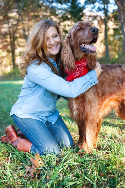 Woman hugging dog