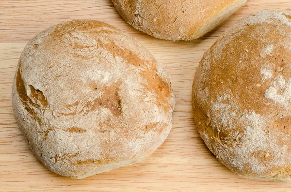 Handmade bread, homemade, close-up on wood