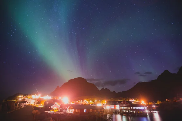 Beautiful picture of massive multicoloured vibrant Aurora Borealis, Aurora Polaris, also know as Northern Lights in the night sky over Norway, Lofoten Islands