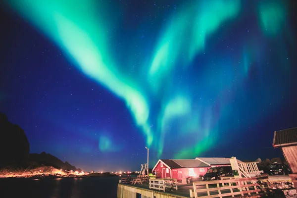 Beautiful picture of massive multicoloured vibrant Aurora Borealis, Aurora Polaris, also know as Northern Lights in the night sky over Norway, Lofoten Islands