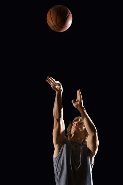 Man throwing basketball