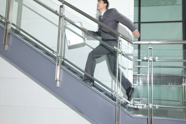 Business Man Running Up Stairs