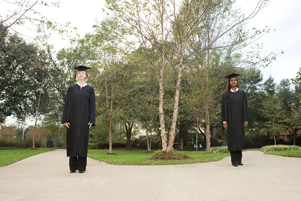 Two female graduates choosing a path