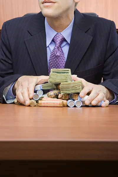 Businessman holding stack of money