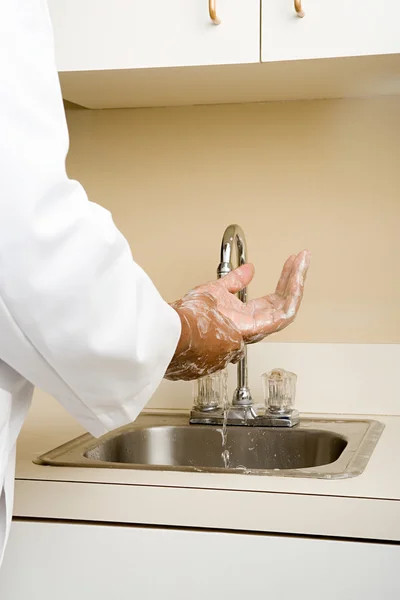 A doctor washing his hands