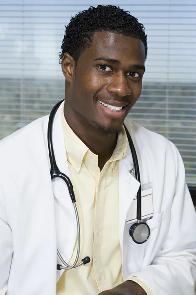 Young black doctor smiling