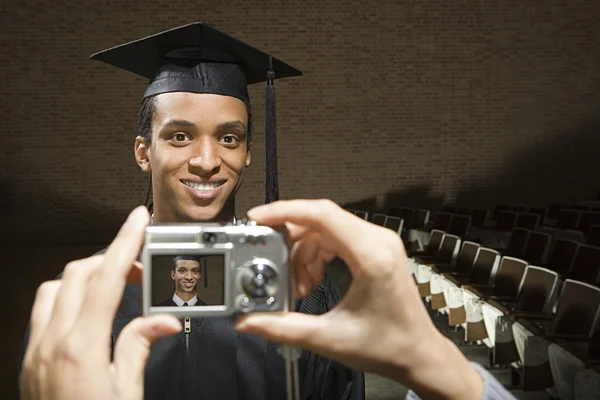 Male graduate being photographed