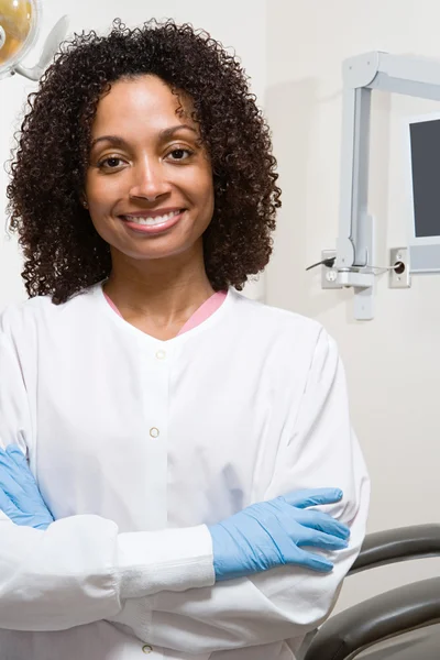 Dentist smiling in medicine cabinet