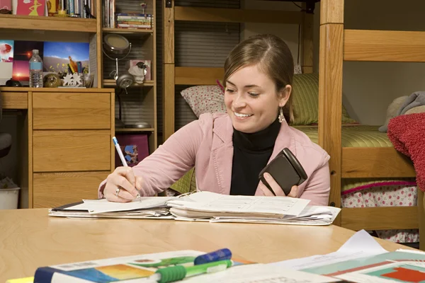 Female student studying in her dormitory