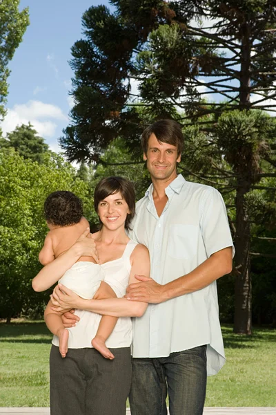 Family standing in garden