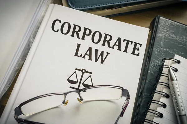 Corporate law book. Justice and legislation concept.