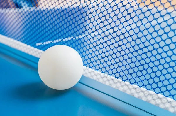 Table tennis ball and net for playing ping pong. Sport concept.