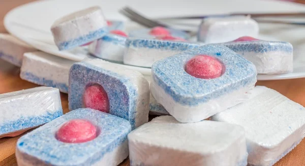 Dishwasher tablets for cleaning dishes. Detergent or cleaning agent.