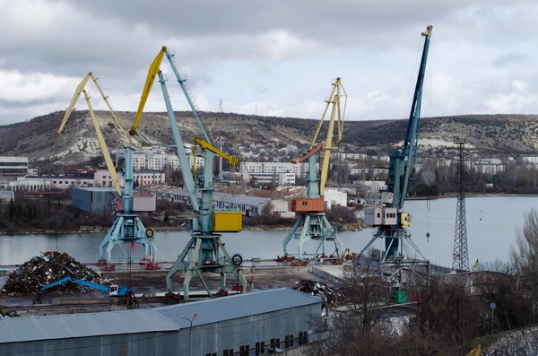 Recycling, loading scrap metal in the ship