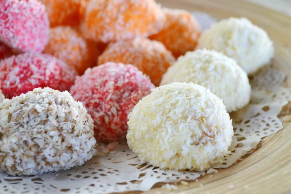 Orange, white and pink coconut candies