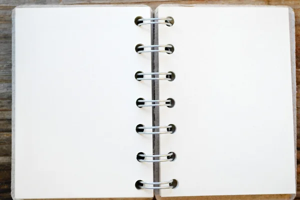 An empty retro spiral notebook with old paper