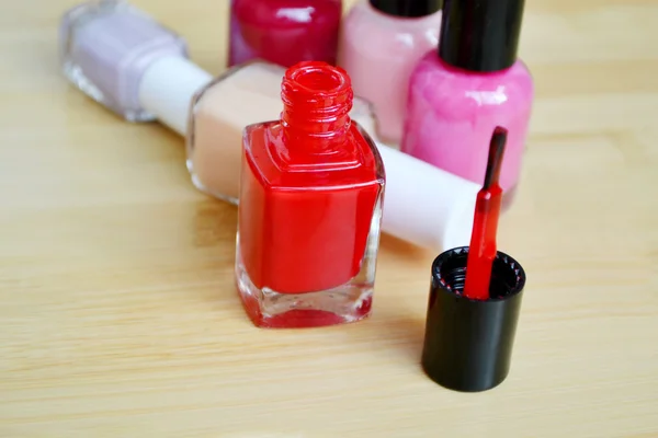 A bottle of red nail polish closeup