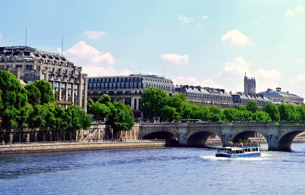 PARIS, FRANCE - 25 MAY, 2015: Rivar Seine over blue sky and cityscape of Paris city