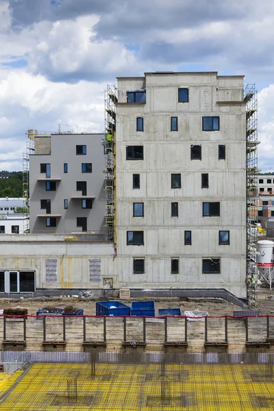 Vertical photo of house apartment construction site with scaffolding