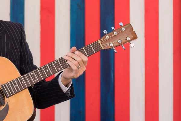 Musician playing on guitar