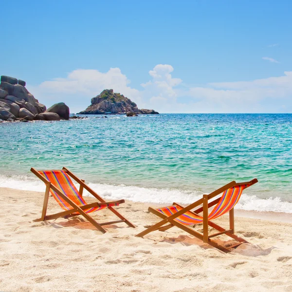 Lounge chairs on the bay beach