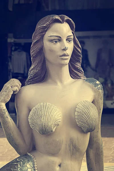 Colored sculpture of beautiful mermaid