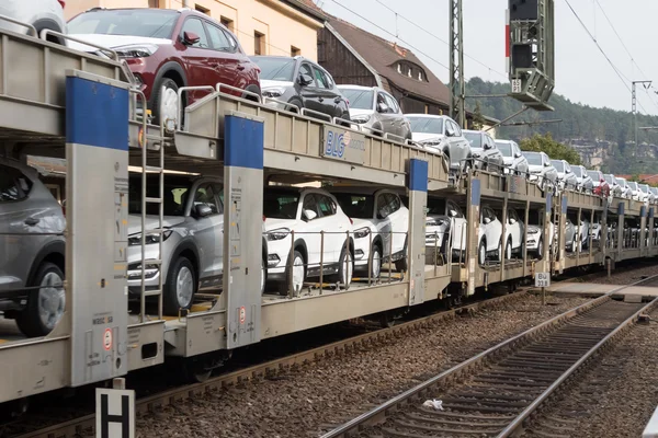 Transporting cars by rail