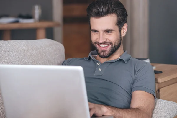 Young man using his laptop