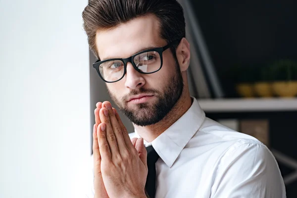 Handsome young businessman in glasses