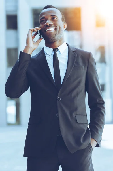 Man in formalwear talking on the mobile phone