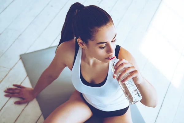 Woman with bottle of water