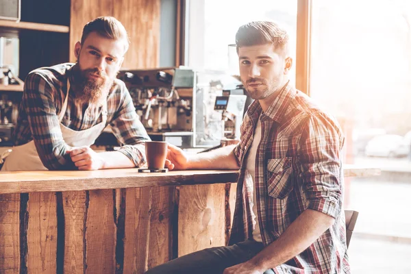 handsome men at bar counter