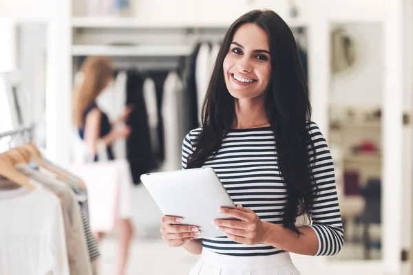 Woman holding digital tablet