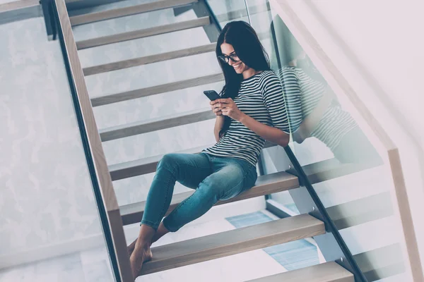 Woman looking at her mobile phone