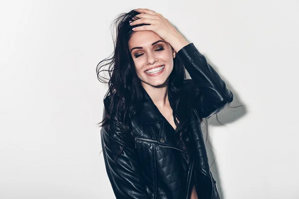 Woman in unbuttoned leather jacket