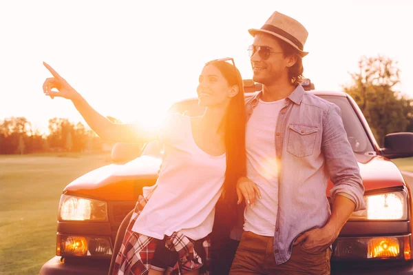 Couple  leaning at their pick-up truck