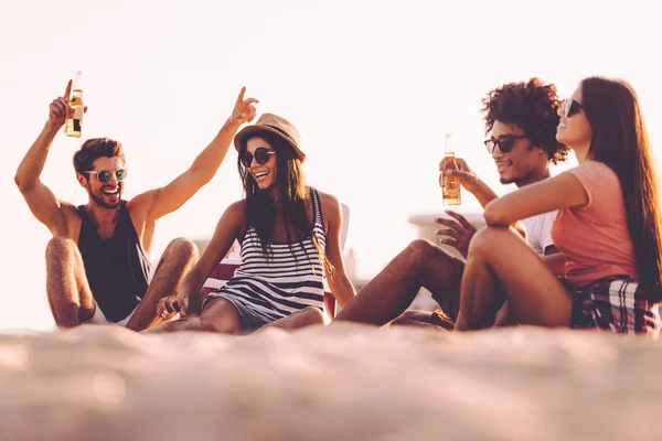 Young people drinking beer and talking