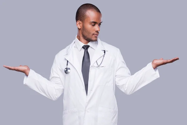 African doctor holding copy space