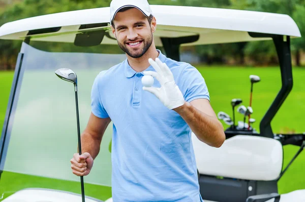 Man holding golf ball