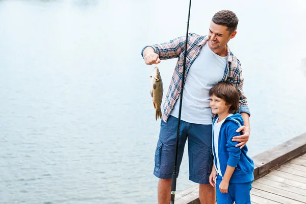 Father holding fishing rod