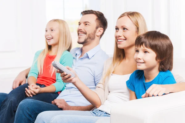 Family  watching TV at home