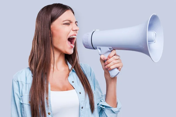 Woman shouting through a megaphone