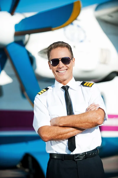 Confident male pilot in uniform