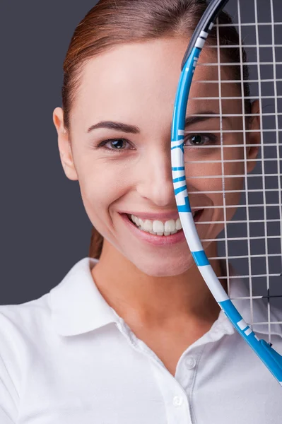 Woman holding tennis racket
