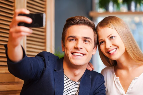 Couple making selfie by smart phone