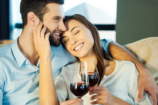 Loving couple drinking red wine