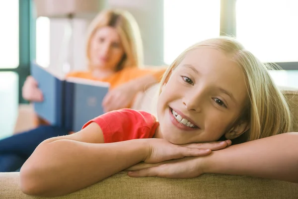 Little girl sitting on the couch