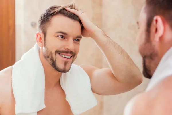 Man touching his hair