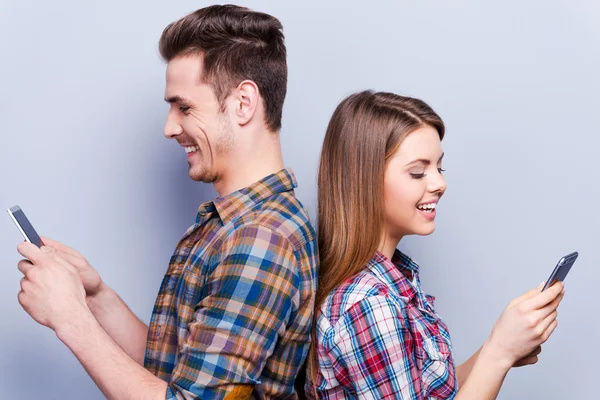 Couple holding mobile phones