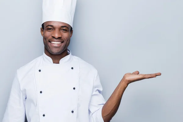 African chef holding copy space